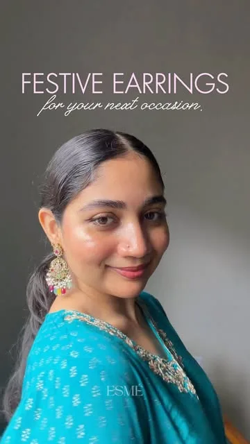 Wearing ESMÉ festive earrings with a teal kurta